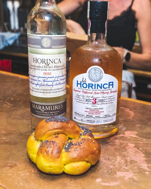 Bucharest: Romanian Spirits Tasting Experience at Corks - Slănină, cured meats, and cheese on the table